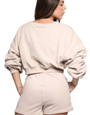 Tan set from back with shorts and sweater